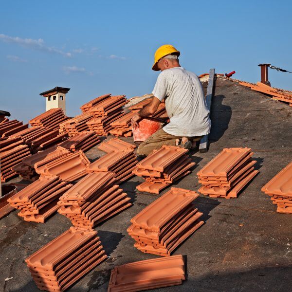 Roofing Guys Brisbane installing a new tile roof using quality terracotta tiles. We handle tile roof repairs, re-tiling, and full replacements.