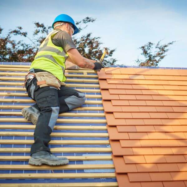 Roofing Guys Brisbane installing a new tiled roof with precision and care. We specialise in tile roof installations, re-roofing, repairs, and complete roof replacements Roofing Guys Brisbane installing a new tiled roof with precision and care. We specialise in tile roof installations, re-roofing, repairs, and complete roof replacements