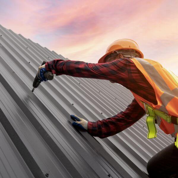 Roofing Guys Brisbane metal roofing specialist installing a Colorbond roof. We provide expert metal roof repairs, replacements, new installations, and tile-to-metal roof conversions