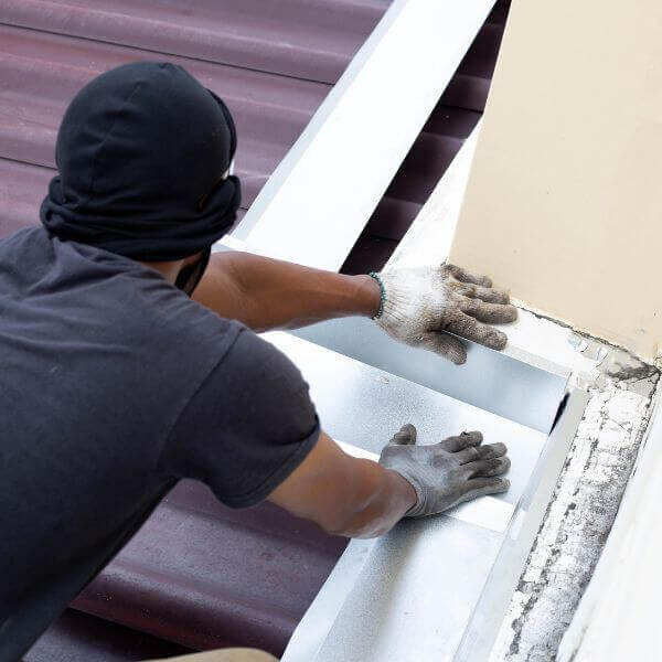 Roofing Guys Brisbane technician repairing flashing during a residential roof maintenance job in Brisbane. Roofing Guys Brisbane technician repairing flashing during a residential roof maintenance job in Brisbane.