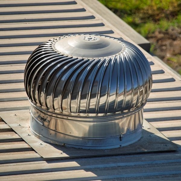 Newly installed whirlybird on a metal roof in Brisbane, providing improved ventilation and heat reduction by Roofing Guys Brisbane.